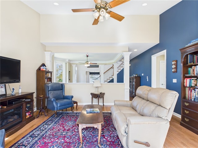 6 Yarmouth Cir S, Kingstown, RI 02879 - living area with a towering ceiling, wood finished floors, a ceiling fan, and ornate columns