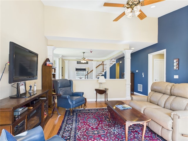 6 Yarmouth Cir S, Kingstown, RI 02879 - living area with visible vents, wood finished floors, a ceiling fan, and ornate columns