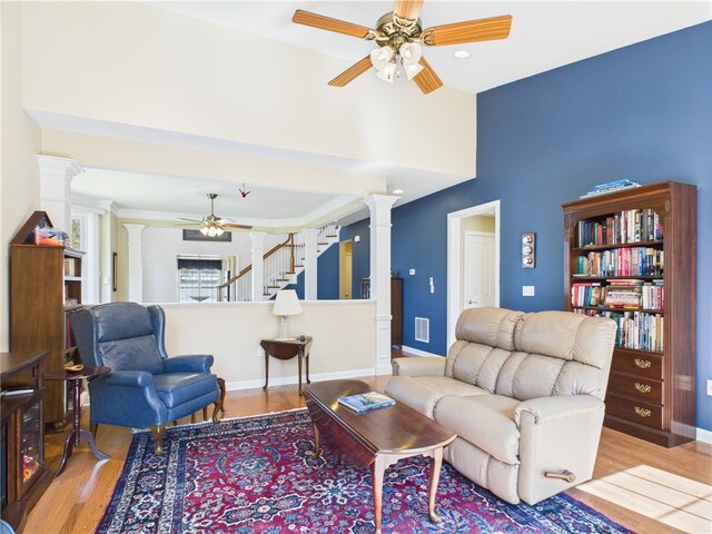 6 Yarmouth Cir S, Kingstown, RI 02879 - living area with wood finished floors, a ceiling fan, ornate columns, and visible vents