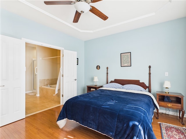 6 Yarmouth Cir S, Kingstown, RI 02879 - bedroom featuring connected bathroom, wood finished floors, and a ceiling fan
