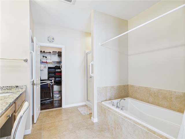 6 Yarmouth Cir S, Kingstown, RI 02879 - full bath featuring a garden tub, a stall shower, tile patterned flooring, vanity, and a spacious closet