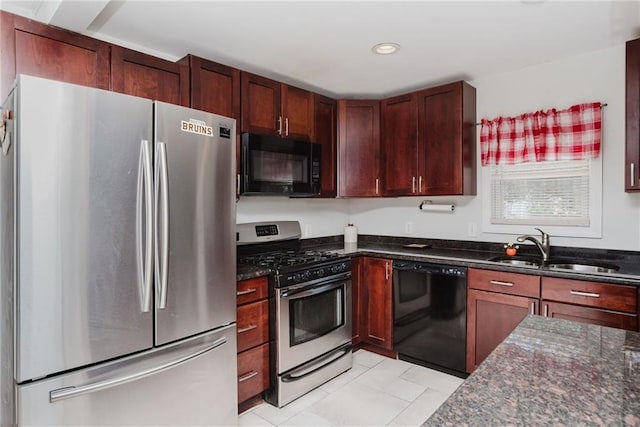 kitchen featuring black appliances, dark stone counters, recessed lighting, and a sink