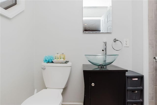 bathroom with toilet and vanity
