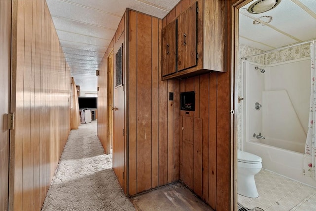 interior space featuring wooden walls