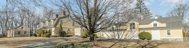 view of side of home featuring a chimney