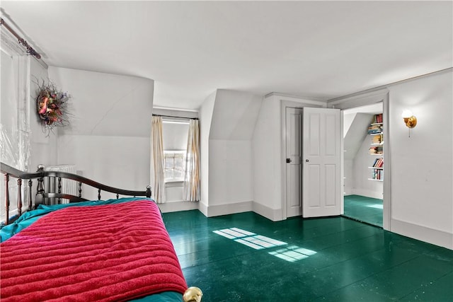 bedroom featuring baseboards and tile patterned floors