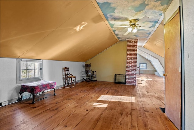 bonus room with vaulted ceiling, ceiling fan, and wood-type flooring