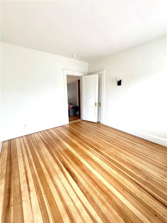 spare room featuring light wood finished floors