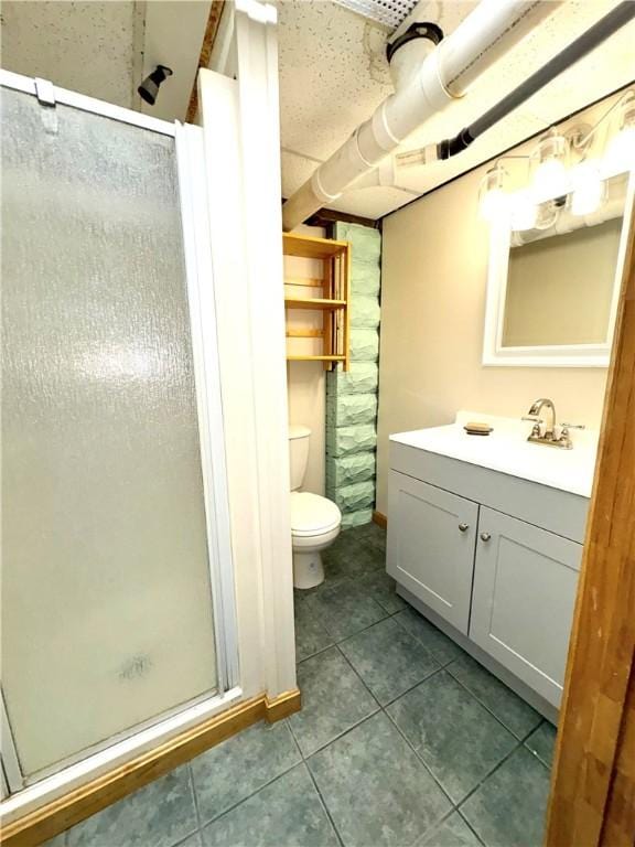 bathroom with a stall shower, tile patterned flooring, toilet, and vanity