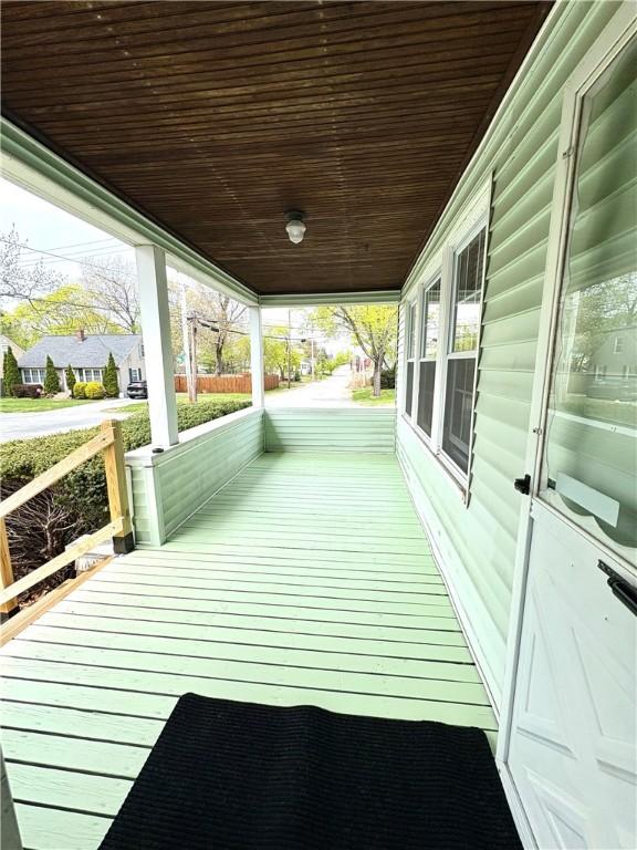 wooden terrace featuring covered porch