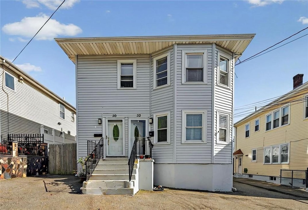 view of front of property featuring fence