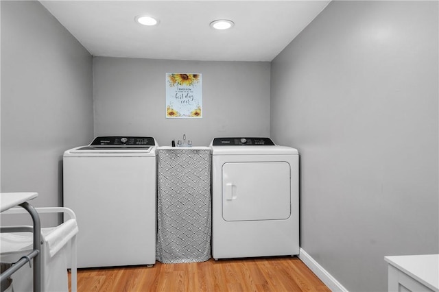 745 Eagle Peak Rd, Burrillville, RI 02859 - clothes washing area featuring washer and dryer, light wood-style floors, and recessed lighting