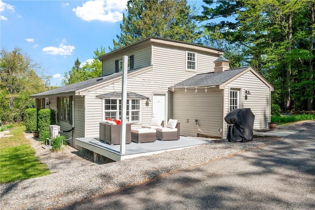 745 Eagle Peak Rd, Burrillville, RI 02859 - rear view of house featuring a shingled roof, a patio area, and ac unit