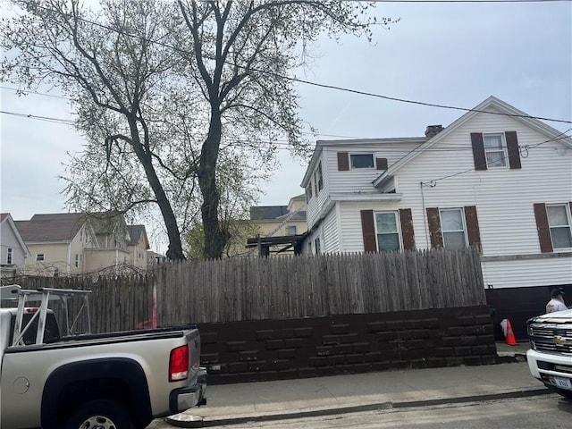 view of property exterior with fence