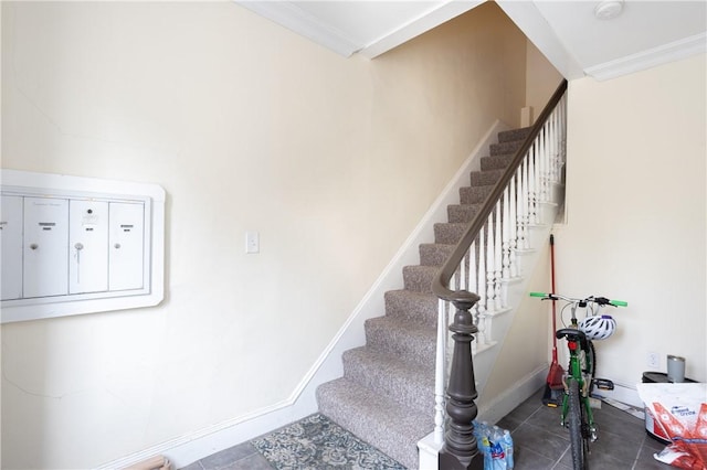 85 Mill St, Newport, RI 02840 - stairway with tile patterned floors, crown molding, and baseboards