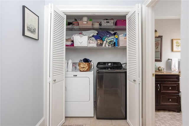 85 Mill St, Newport, RI 02840 - laundry area with independent washer and dryer, crown molding, and light tile patterned floors