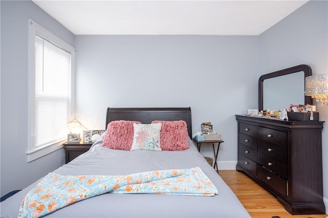 85 Mill St, Newport, RI 02840 - bedroom with light wood finished floors, multiple windows, and baseboards