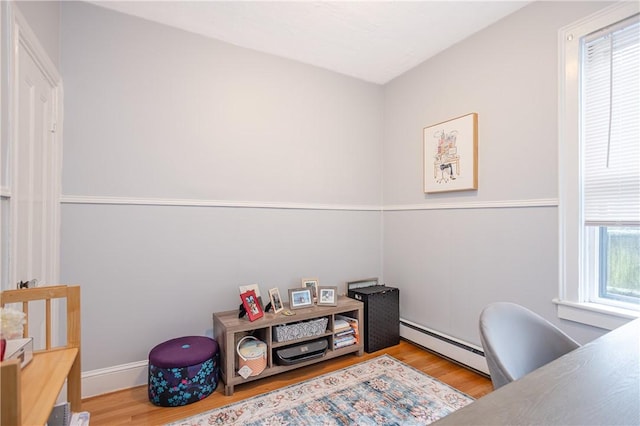 85 Mill St, Newport, RI 02840 - office area featuring a baseboard radiator, wood finished floors, and baseboards