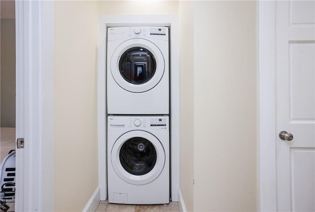 85 Mill St, Newport, RI 02840 - laundry area with stacked washer / drying machine, baseboards, and light tile patterned floors