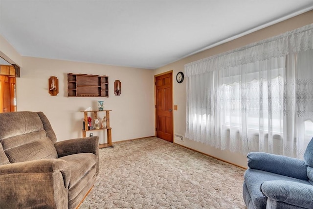 living area with carpet flooring and baseboards