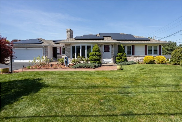 ranch-style home featuring a chimney, stone siding, a front lawn, and a garage