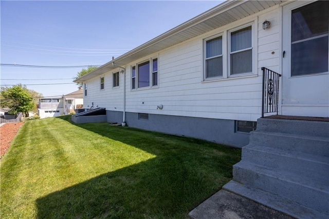 view of property exterior featuring a yard