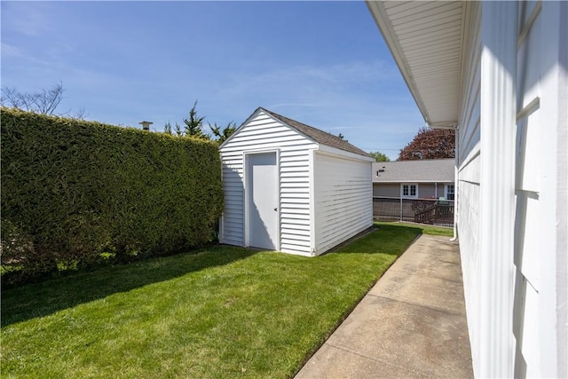 view of shed featuring fence