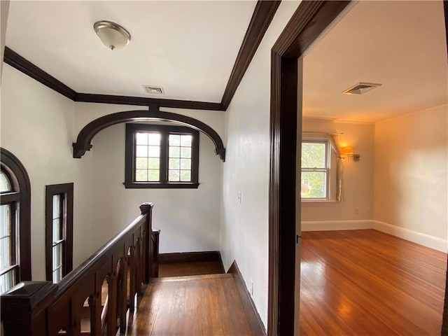 404 Lloyd Ave Unit 408, Providence, RI 02906 - stairway featuring crown molding, wood finished floors, baseboards, and healthy amount of natural light