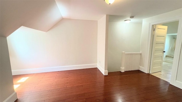 404 Lloyd Ave Unit 408, Providence, RI 02906 - additional living space with hardwood / wood-style floors, vaulted ceiling, and baseboards