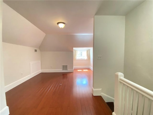 404 Lloyd Ave Unit 408, Providence, RI 02906 - bonus room with dark wood-type flooring, baseboards, and lofted ceiling