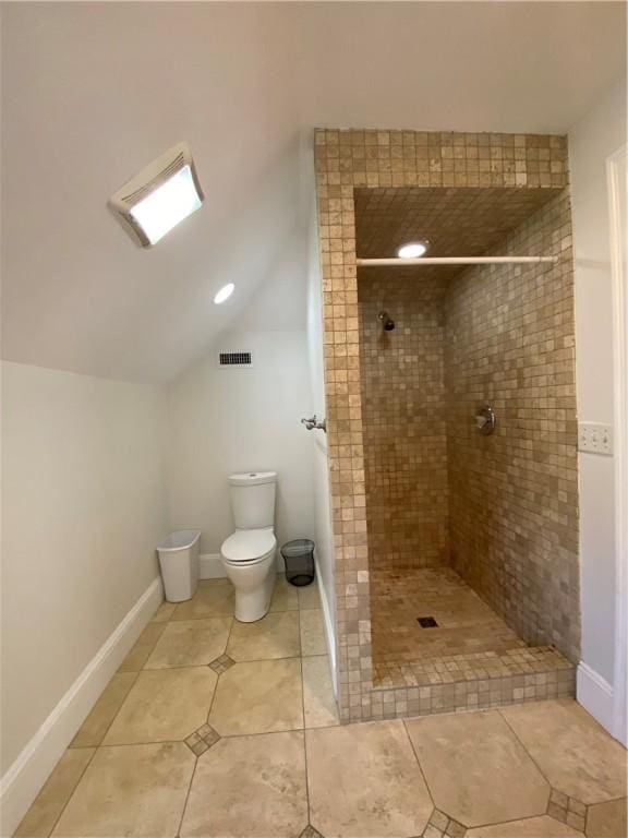 404 Lloyd Ave Unit 408, Providence, RI 02906 - full bath with a tile shower, toilet, tile patterned flooring, and vaulted ceiling