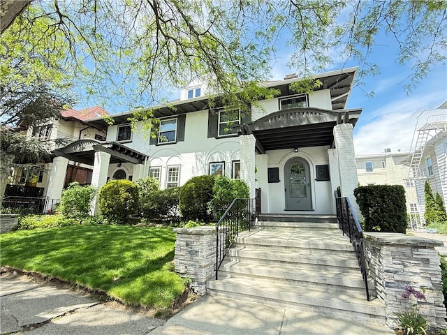 404 Lloyd Ave Unit 408, Providence, RI 02906 - view of front facade with stucco siding and a front lawn