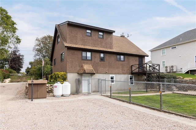 82 Uzzi Ave, Westerly, RI 02891 - back of house with a gate, fence, and a chimney