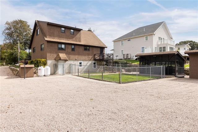 82 Uzzi Ave, Westerly, RI 02891 - view of community with gravel driveway, fence, and a gate