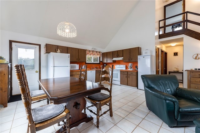 82 Uzzi Ave, Westerly, RI 02891 - dining space with light tile patterned flooring and high vaulted ceiling