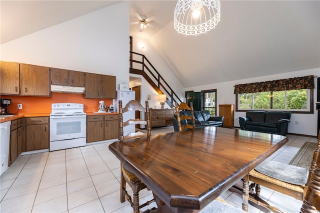 82 Uzzi Ave, Westerly, RI 02891 - dining room with light tile patterned floors, a ceiling fan, and high vaulted ceiling