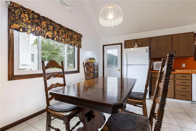 82 Uzzi Ave, Westerly, RI 02891 - dining room with lofted ceiling, a wealth of natural light, light tile patterned floors, and a chandelier