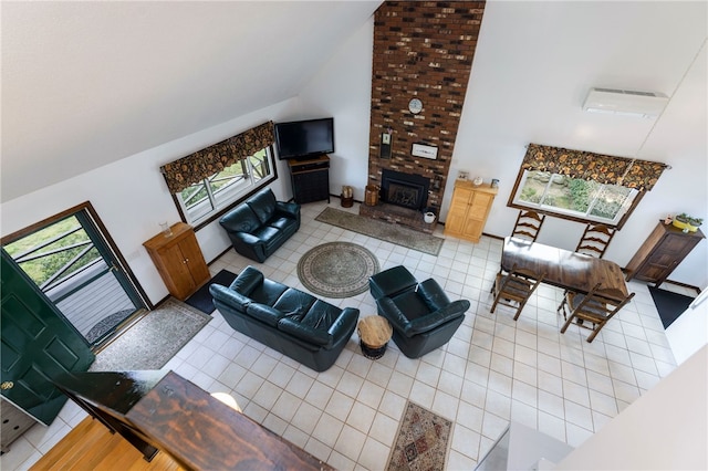 82 Uzzi Ave, Westerly, RI 02891 - living area featuring a fireplace, light tile patterned flooring, and high vaulted ceiling