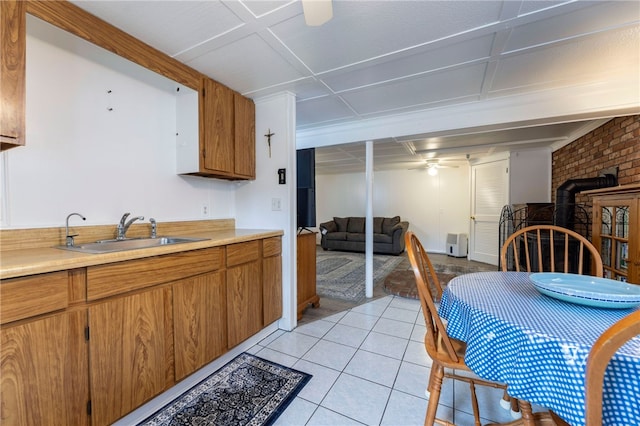 82 Uzzi Ave, Westerly, RI 02891 - kitchen featuring light countertops, light tile patterned floors, open floor plan, and a sink