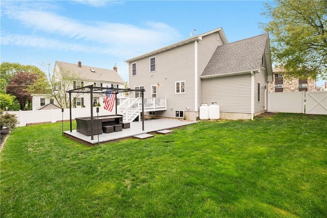 rear view of property featuring a deck, a patio, a pergola, a jacuzzi, and a gate