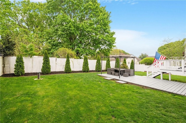 view of yard featuring a wooden deck, a pergola, and an outdoor hangout area