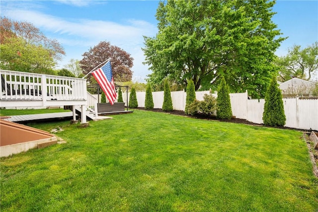 view of yard featuring a wooden deck