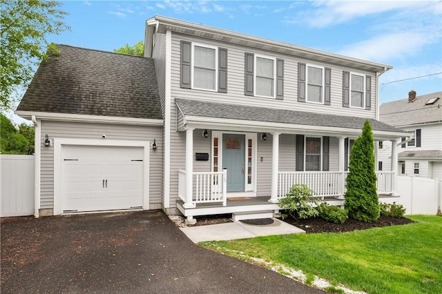 view of front of home featuring a porch, asphalt driveway, an attached garage, and roof with shingles