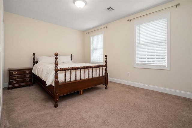 carpeted bedroom with baseboards