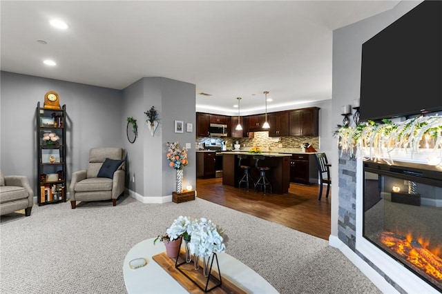 40 Saw Mill Dr Unit 203, North Kingstown, RI 02852 - living room with dark colored carpet, recessed lighting, and baseboards