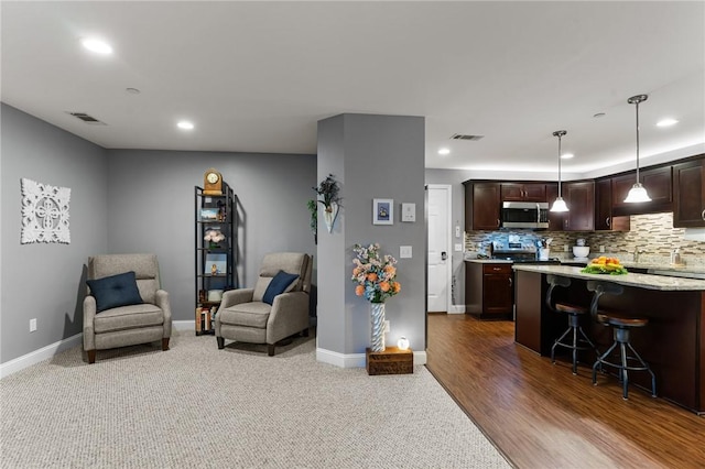40 Saw Mill Dr Unit 203, North Kingstown, RI 02852 - living area with recessed lighting, baseboards, and carpet flooring