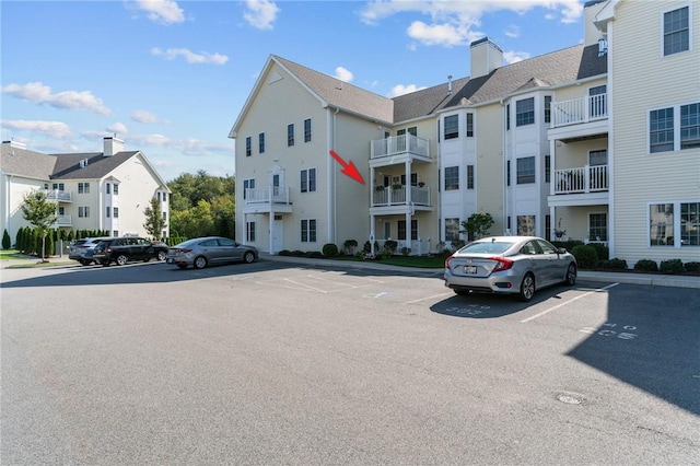 40 Saw Mill Dr Unit 203, North Kingstown, RI 02852 - view of building exterior featuring uncovered parking