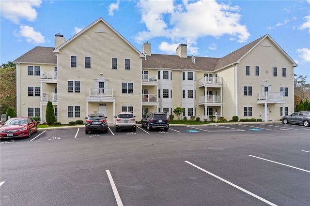 40 Saw Mill Dr Unit 203, North Kingstown, RI 02852 - view of apartment building / complex featuring uncovered parking