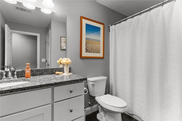 40 Saw Mill Dr Unit 203, North Kingstown, RI 02852 - full bathroom with toilet, vanity, baseboards, and tile patterned floors