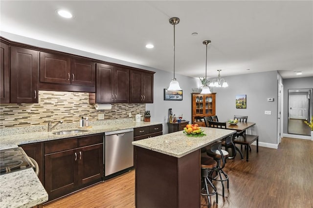 40 Saw Mill Dr Unit 203, North Kingstown, RI 02852 - kitchen featuring stainless steel dishwasher, light wood-style floors, tasteful backsplash, a sink, and recessed lighting